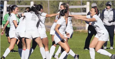  ?? GREG SORBER/JOURNAL ?? La Cueva players celebrate after their 3-2 win over Cibola in the Class 5A semifinals Thursday. The eighth-seeded Bears will play No. 2 Sandia in today’s final.