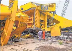  ?? PTI ?? Officials inspect the crash site at the Hindustan Shipyard in Visakhapat­nam on Saturday. n