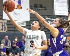  ??  ?? Rochester’s Alexis Robison drives to the basket Tuesday against Bishop Guilfoyle.