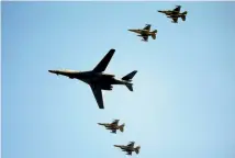  ?? PHOTO: REUTERS ?? A US Air Force B-1B bomber and four fighter escorts fly over Osan Air Base in Pyeongtaek, South Korea.