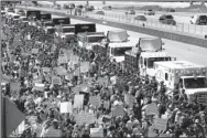  ?? JIM YOUNG / AGENCE FRANCE-PRESSE ?? Protesters shut down the Dan Ryan Expressway during an anti-violence protest calling for gun law reform on Saturday in Chicago.