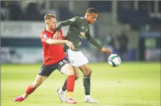  ??  ?? Manchester United’s Mason Greenwood (right), is challenged by Luton Town’s Rhys Norrington-Davies during the English League Cup 3rd round soccer match between Luton Town and Manchester United on Sept 22, at Kenil
worth Road in Luton, England. (AP)