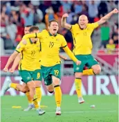  ?? ?? Australian players celebrate winning the FIFA World Cup 2022 inter-confederat­ion play-offs match against Peru at the Ahmed bin Ali Stadium in Ar-Rayyan, Qatar, on Monday. Australia won 5-4 on penalties. —