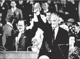  ?? AFP/Getty Images ?? BARRY GOLDWATER, right, and his running mate William Miller accept the Republican Party’s nomination in San Francisco in July 1964.