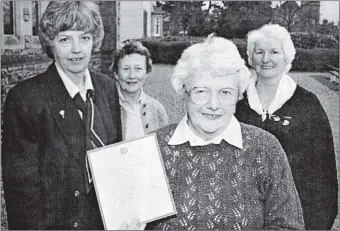  ?? Picture: Anthony MacMillan. ?? 1998: Margaret MacFarlane, centre, of Glencoe, who received her long-service certificat­e for 17 years service to the WRVS.