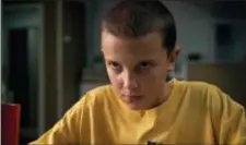  ?? NETFLIX VIA AP ?? This image released by Netflix shows Millie Bobby Brown in a scene from “Stranger Things.” Brown portrays Eleven, who can move things with her mind and is the fascinatin­g secret friend of a group of pre-teen boys in the fictional town of Hawkins, Ind.