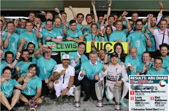  ?? AP ?? United front: Mercedes celebrate a one-two after Rosberg beat Hamilton (centre) in Abu Dhabi