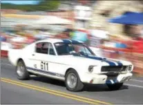  ??  ?? A Mustang GT roars down Lincoln Highway during the second annual Coatesvill­e Invitation­al Vintage Grand Prix Saturday.