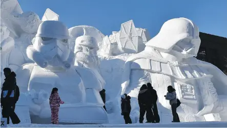  ?? AFP/ GETTY IMAGES/ FILES ?? Visitors gather around a large snow sculpture at the 66th annual Sapporo Snow Festival in 2015. The Japanese city, the capital of Hokkaido island, is a great base for exploring Japan’s hot springs and mountains. Even better, it has its own beer museum.