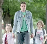  ??  ?? Scott is tasked with walking home the two young children of his mother’s new boyfriend in ‘‘The King of Staten Island.’’