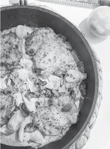  ?? KRISTEN MENDIOLA/THE DAILY MEAL PHOTOS; SHANNON KINSELLA/FOOD STYLING ?? Supper club-inspired chicken with artichokes and cream makes a luxurious — yet easy — weekday meal.