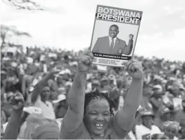  ??  ?? Botswana Democratic Party (BDP) supporters celebrate after the party won the presidenti­al election