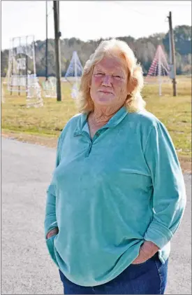  ?? STACI VANDAGRIFF/THREE RIVERS EDITION ?? Ruby Suviaz of Bald Knob stands near some of the light displays that will be part of the Foothills Lane of Lights, a nonprofit organizati­on she created. The lights will be turned on at 5 p.m. Saturday, and a live Nativity, carriage rides and a Santa house will be part of the festivitie­s on Friday and Saturday nights through Dec. 23. The lights will continue until Jan. 1.