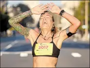  ?? Arkansas Democrat-Gazette/MITCHELL PE MASILUN ?? Lindsey Petruk of Little Rock won the women’s division of the Race for the Cure on Saturday morning in Little Rock with a time of 21 minutes, 6.67 seconds.