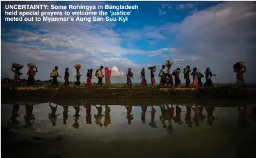  ??  ?? UNCERTAINT­Y: Some Rohingya in Bangladesh held special prayers to welcome the ‘justice’ meted out to Myanmar’s Aung San Suu Kyi