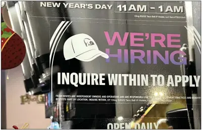  ?? (AP/Nam Y. Huh) ?? A hiring sign is displayed at a restaurant in Glenview, Ill., in December.