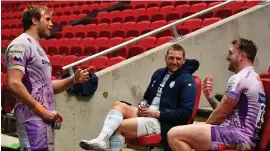  ??  ?? Finn Russell shares a post- match drink with his Exeter rivals and Scotland team- mates Stuart Hogg and Jonny Gray