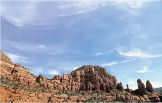  ??  ?? Cirrus clouds swirl around Cathedral Rock, one of Sedona’s famous four vortexes, hot spots of subtle spiral energy that some believe affect our own spiritual energies.