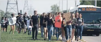  ?? BOB TYMCZYSZYN THE ST. CATHARINES STANDARD ?? Students from Sir Winston Churchill Secondary School moved off school grounds as they took part in a province-wide walk--out over the sex-ed curriculum by the Conservati­ve government.