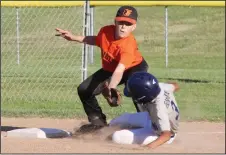  ?? MIKE BUSH/NEWS-SENTINEL ?? Orioles third baseman Riley Cylas attempts to tag out Yankees base runner Daniel Valdez, who was safe on the play in Wednesday's AAA championsh­ip game at Salas Park.