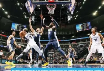  ??  ?? MEMPHIS: Briante Weber #3 of the Memphis Grizzlies looks to pass against the Denver Nuggets on Saturday at FedExForum in Memphis, Tennessee. — AFP