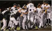  ?? PHOTO BY ALEX GALLARDO ?? Notre Dame players celebrate after defeating Huntington Beach in the Boras Classic on Friday night.