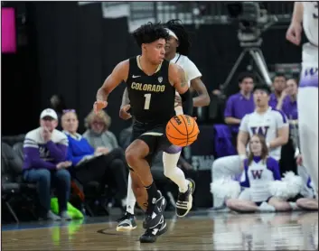  ?? POWERS IMAGERY ?? Colorado’s Julian Hammond III, dribbles down the court against Washington during the first round of the Pac-12 Tournament on Wednesday at T-mobile Arena in Las Vegas.