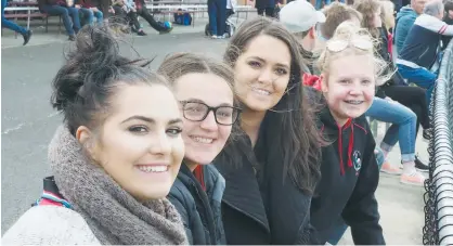  ??  ?? With their seats on the boundary fence Warragul supporters, from left, Brooke Orlicki, Chiara Mulqueen, Tahlia Orlicki and Mikki Gardiner waited eagerly for the start of the senior eliminatio­n final.