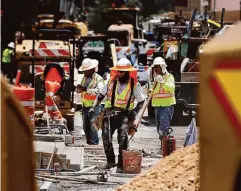  ?? ?? OSHA is working on rule language telling employers how to protect workers from extreme heat, such as these last year on Main Street.