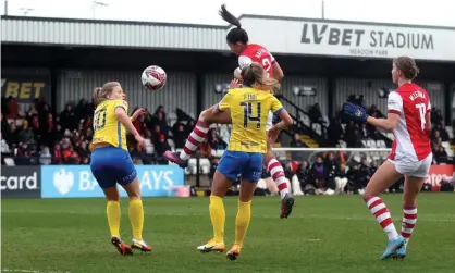  ?? Childs/Action Images/Reuters ?? Rafaelle Souza climbs highest to open the scoring for Arsenal in what proved an exciting encounter at Meadow Park. Photograph: Matthew