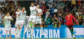  ?? AP PHOTO BY FRANK AUGSTEIN ?? Portugal’s Cristiano Ronaldo scores his third goal Friday with a free kick during the group B match between Portugal and Spain at the 2018 World Cup in the Fisht Stadium in Sochi, Russia.