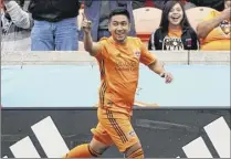  ?? David J. Phillip / Associated Press ?? Houston Dynamo’s Memo Rodriguez celebrates after scoring a goal against the Vancouver Whitecaps during the first half Saturday in Houston.