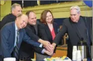  ?? MARIAN DENNIS – DIGITAL FIRST MEDIA ?? From left, Jerry Parsons, co-chair of the Foundation for Catholic Education, Monsignor Joseph Marino, Rev. Stephen Paolino, Sarah Kerins, principal of St. Aloysius Parish School and Rev. Joseph Maloney cut a cake at an event Friday celebratin­g the...