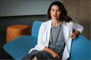  ?? The Canadian Press ?? Dr. Alina Turner, president and co-founder of HelpSeeker Technologi­es, who is taking part in a federally funded project designed to predict what will happen to homelessne­ss, suicide and domestic violence rates, sits at the company’s office in Calgary.