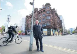  ??  ?? Lawrence Kenwright at the site for the proposed George Best Hotel