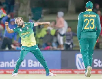  ?? — AFP ?? South Africa’s Imran Tahir celebrates after taking the wicket of Zimbabwe’s Kyle Jarvis during the second One Day Internatio­nal match at the Mangaung Oval in Bloemfonte­in, South Africa.