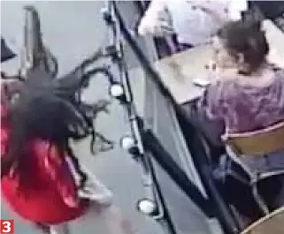  ??  ?? The man slaps her with such force she stumbles against the cafe’s barrier