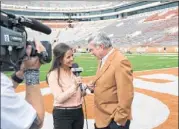  ?? Longhorn network ?? Kaylee Hartung interviews Texas Longhorns football coach Mack Brown.