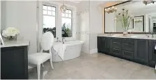  ??  ?? A spacious soaker tub makes this master bathroom a luxurious sanctuary.