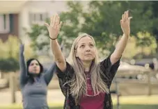  ?? Photograph­s by Samanta Helou Hernandez For The Times ?? A GRIEF YOGA class led by Paul Denniston, below, included Lupe Carranza, top, and Amy Neville, above, who dedicated the session to her late son, Alexander, seen in photo at left.