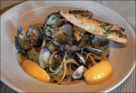  ?? SHERRY LAVARS — MARIN INDEPENDEN­T JOURNAL ?? Gravity Tavern's Linguini and Clams comes with Manila clams, white wine, garlic, parsley, chili flakes and grilled sourdough.