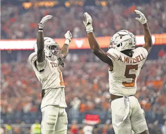  ?? AARON E. MARTINEZ/AUSTIN AMERICAN-STATESMAN ?? Texas Longhorns wide receivers Adonai Mitchell and Xavier Worthy could be celebratin­g at the NFL draft after clocking fast 40-yard times at the NFL combine.