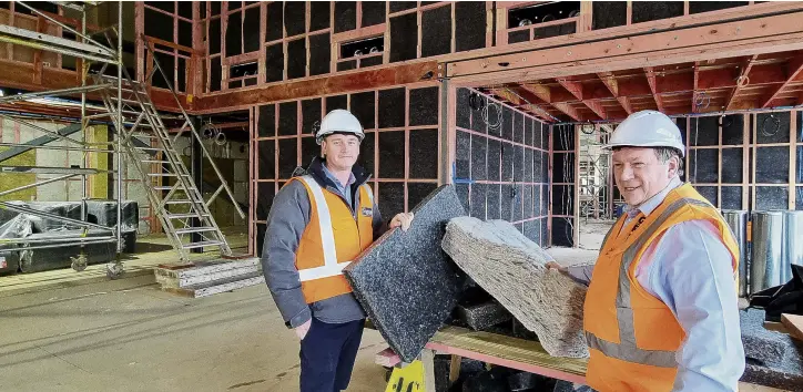  ?? PHOTO: SUPPLIED ?? On the job . . . Signal Management constructi­on manager Nick Jones (left) and Gore District Council facilities administra­tion officer Neil Mair with samples of the woolblend product being installed in the council’s new community centre and Gore Library.