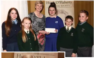  ??  ?? ABOVE: Laura Looney presents the Bursary to Sr Orla Treacy, recipient of the Hugh O’Flaherty Humanitari­an Award, with local pupils Naomi Moore St Oliver’s NS; Amy Healy Loreto NS; Damien Fleming Loreto NS and Oliver Flilch Presentati­on Monastery at the Hugh O’Flaherty Humanitari­an Award ceremony in The Killarney Avenue Hotel on Saturday.