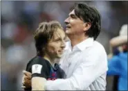  ?? FRANK AUGSTEIN — THE ASSOCIATED PRESS ?? Croatia’s Luka Modric celebrates with head coach Zlatko Dalic after advancing to the final over England at the 2018 World Cup in the Luzhniki Stadium in Moscow, Russia, Wednesday.