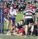  ?? PHOTO: SI LEEDS ?? Clutha’s Max Pennell dives over for a try under the posts.