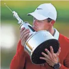  ?? REINHOLD MATAY/USA TODAY SPORTS ?? Rory Mcllroy cradles the Arnold Palmer Invitation­al trophy after his victory Sunday.