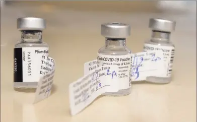  ?? Ned Gerard / Hearst Connecticu­t Media ?? Three vials of the Pfizer COVID-19 vaccine at Stamford Hospital on Thursday.