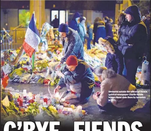  ??  ?? Memorial outside the offices of French satirical newspaper Charlie Hebdo honors those slain there by terrorists in 2015.