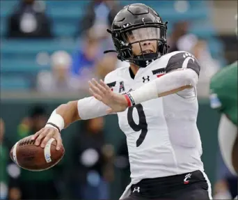  ?? Associated Press ?? Cincinnati quarterbac­k Desmond Ridder is part of a large group of seniors and transfers who helped build the Bearcats into a playoff contender.